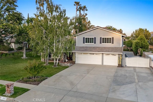 2244 N 1st Ave, Upland, CA 91784 - view of front of home with an attached garage, a gate, and driveway