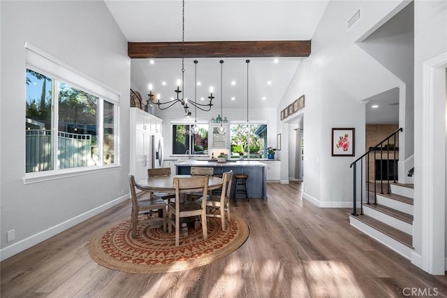 2244 N 1st Ave, Upland, CA 91784 - dining area with high vaulted ceiling, beam ceiling, stairway, healthy amount of natural light, and a chandelier