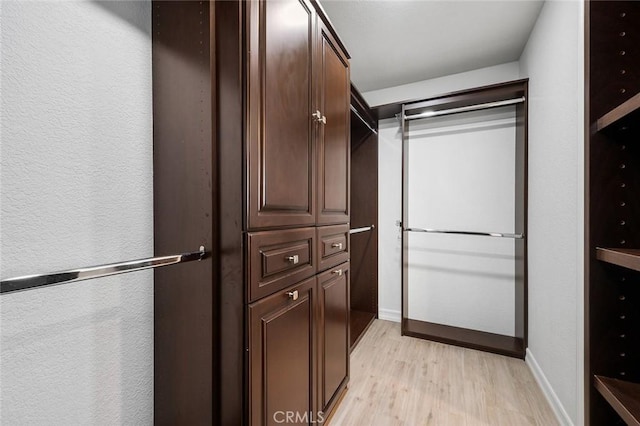 2244 N 1st Ave, Upland, CA 91784 - walk in closet with light wood-style floors