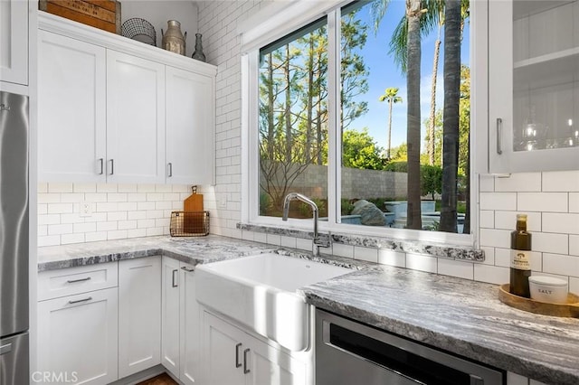 2244 N 1st Ave, Upland, CA 91784 - kitchen featuring appliances with stainless steel finishes, backsplash, white cabinets, light stone counters, and glass insert cabinets