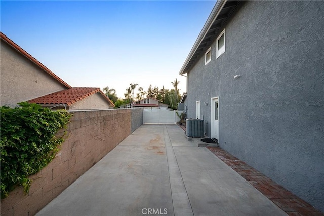 2244 N 1st Ave, Upland, CA 91784 - view of side of home featuring stucco siding, a fenced backyard, and a patio