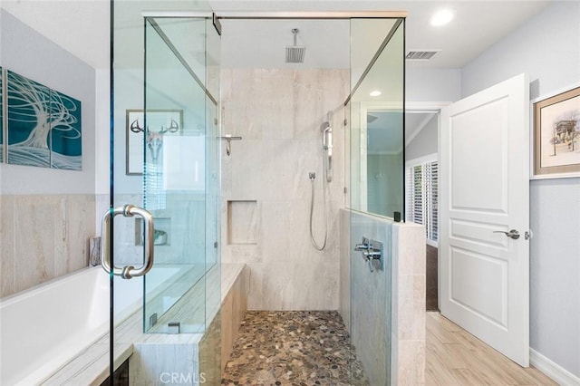 2244 N 1st Ave, Upland, CA 91784 - bathroom with a stall shower, a bath, and recessed lighting