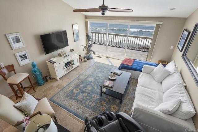 1744 Tattenham Rd, Encinitas, CA 92024 - living room featuring stone tile floors, a ceiling fan, and baseboards