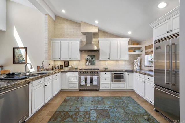 1744 Tattenham Rd, Encinitas, CA 92024 - kitchen featuring premium appliances, wall chimney range hood, lofted ceiling, a sink, and backsplash