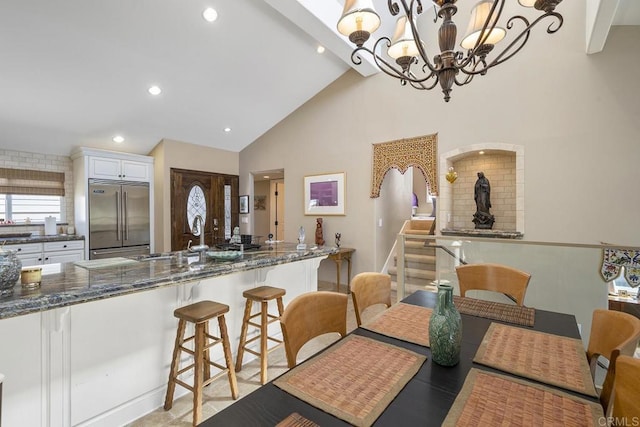 1744 Tattenham Rd, Encinitas, CA 92024 - dining area featuring high vaulted ceiling, a chandelier, and recessed lighting