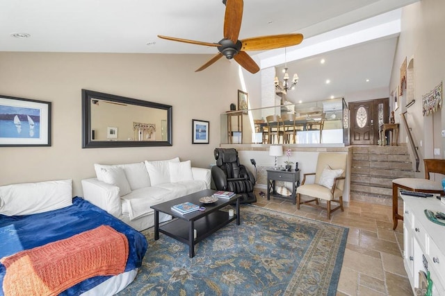 1744 Tattenham Rd, Encinitas, CA 92024 - living area featuring stone tile floors, ceiling fan, a chandelier, and stairway