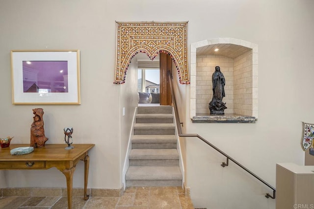 1744 Tattenham Rd, Encinitas, CA 92024 - stairway with baseboards, stone finish flooring, and arched walkways