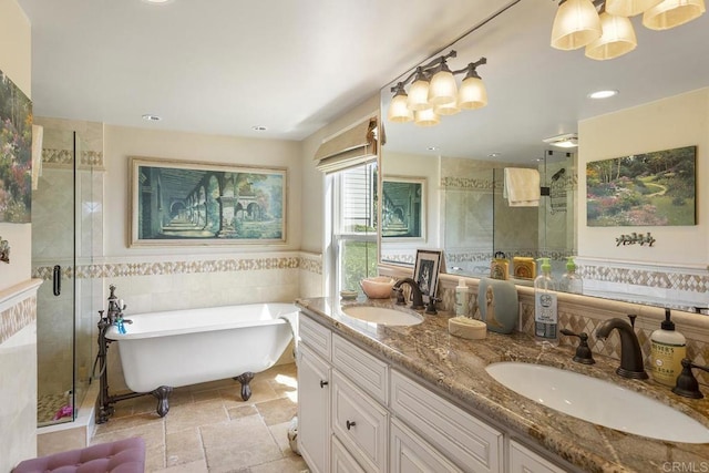 1744 Tattenham Rd, Encinitas, CA 92024 - full bathroom featuring a shower stall, a freestanding tub, double vanity, stone tile flooring, and tile walls