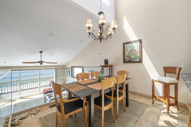 1744 Tattenham Rd, Encinitas, CA 92024 - dining room with high vaulted ceiling, stone tile flooring, and a chandelier