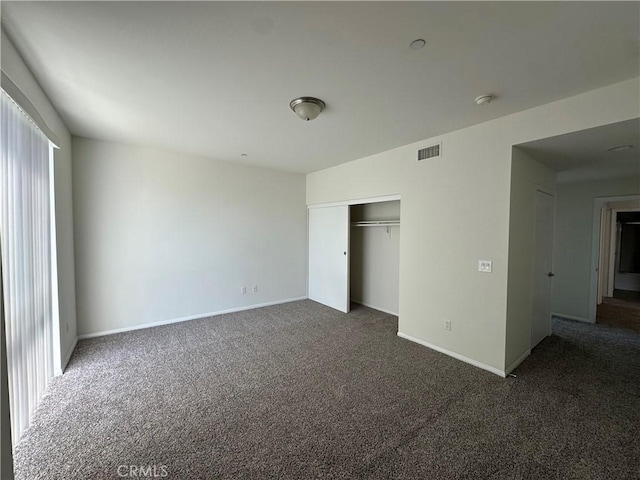 7551 Jordan Ave Unit 410, Canoga Park, CA 91303 - unfurnished bedroom featuring carpet, baseboards, and a closet