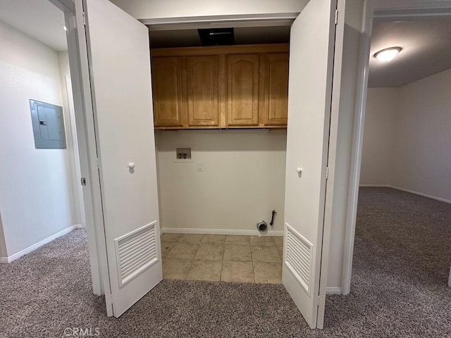 7551 Jordan Ave Unit 410, Canoga Park, CA 91303 - laundry area with hookup for a washing machine, light colored carpet, cabinet space, electric panel, and baseboards