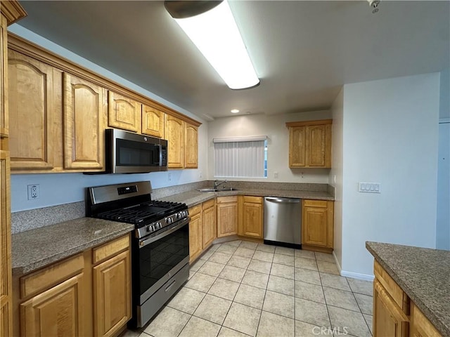 7551 Jordan Ave Unit 410, Canoga Park, CA 91303 - kitchen featuring stainless steel appliances, a sink, light tile patterned flooring, and recessed lighting