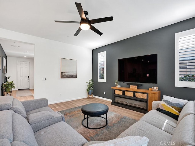 8967 Sunshine Valley Way, Corona, CA 92883 - living room featuring light wood finished floors, ceiling fan, baseboards, and recessed lighting