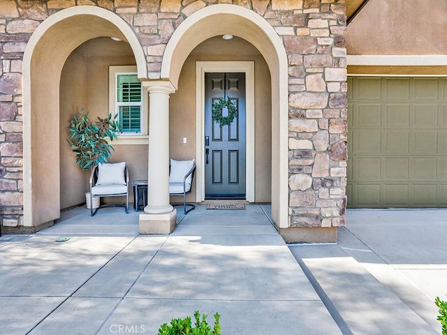 8967 Sunshine Valley Way, Corona, CA 92883 - doorway to property with stone siding and stucco siding