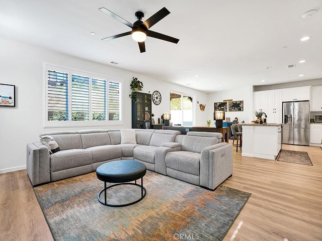 8967 Sunshine Valley Way, Corona, CA 92883 - living area with light wood-style flooring, a ceiling fan, recessed lighting, and baseboards