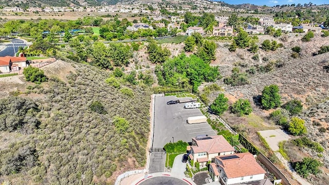 8967 Sunshine Valley Way, Corona, CA 92883 - aerial perspective of suburban area with a mountainous background