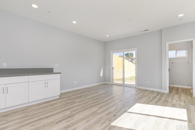 535 60th St, San Diego, CA 92114 - unfurnished living room featuring light wood-type flooring, baseboards, and recessed lighting