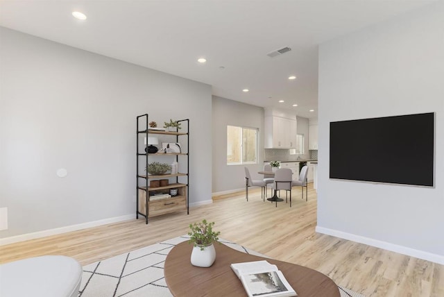 535 60th St, San Diego, CA 92114 - living room featuring light wood finished floors, baseboards, and recessed lighting