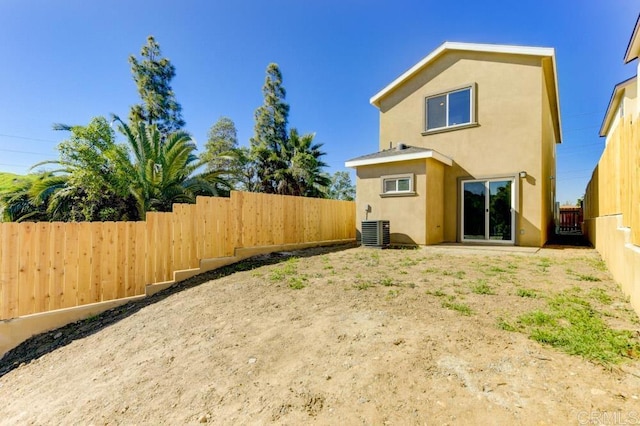 535 60th St, San Diego, CA 92114 - back of property with stucco siding, a fenced backyard, and central AC
