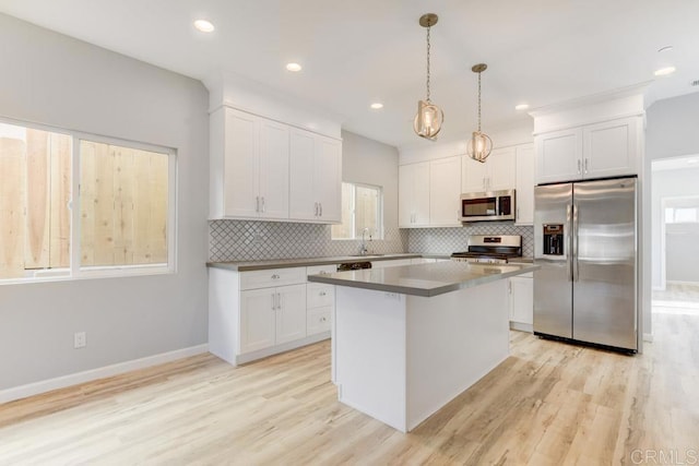535 60th St, San Diego, CA 92114 - kitchen featuring stainless steel appliances, light wood-style flooring, decorative backsplash, and recessed lighting