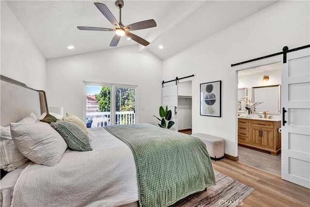 921 Dahlia Ave, Costa Mesa, CA 92626 - bedroom with a barn door, access to outside, light wood-style floors, a sink, and connected bathroom