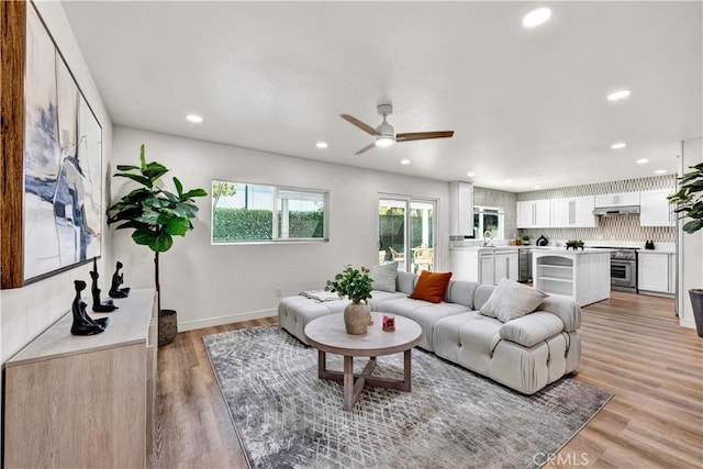 921 Dahlia Ave, Costa Mesa, CA 92626 - living room with a ceiling fan, recessed lighting, light wood-type flooring, and baseboards