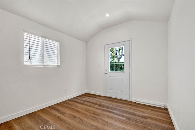 921 Dahlia Ave, Costa Mesa, CA 92626 - unfurnished room with vaulted ceiling, wood finished floors, and baseboards