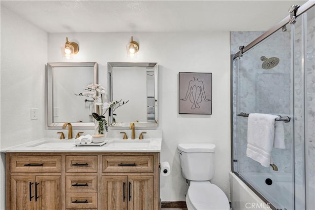 921 Dahlia Ave, Costa Mesa, CA 92626 - bathroom featuring toilet, double vanity, and shower / bath combination with glass door