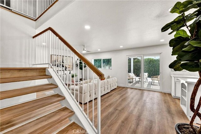 921 Dahlia Ave, Costa Mesa, CA 92626 - stairs with wood finished floors, a ceiling fan, recessed lighting, and baseboards
