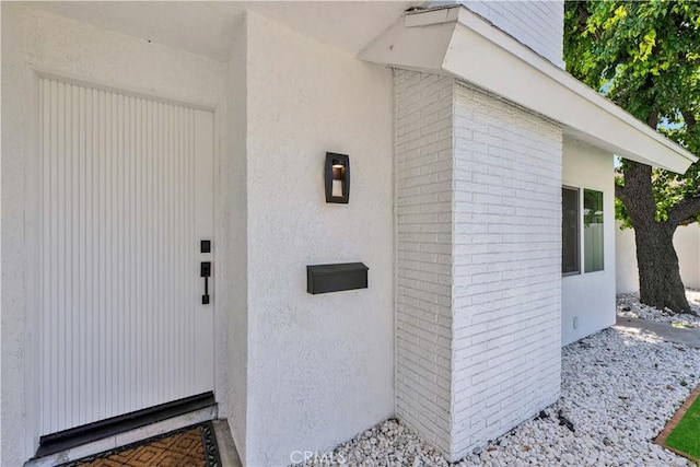 921 Dahlia Ave, Costa Mesa, CA 92626 - entrance to property featuring stucco siding and brick siding