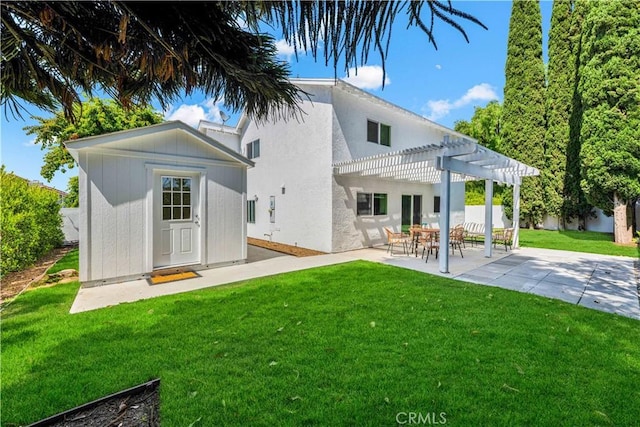 921 Dahlia Ave, Costa Mesa, CA 92626 - rear view of property with a pergola, a yard, a patio area, an outdoor structure, and stucco siding