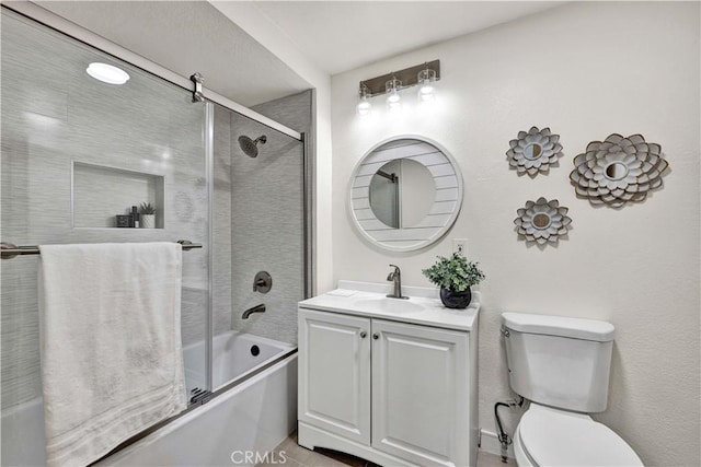 921 Dahlia Ave, Costa Mesa, CA 92626 - bathroom featuring bath / shower combo with glass door, vanity, and toilet