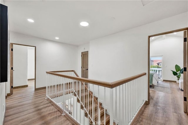 921 Dahlia Ave, Costa Mesa, CA 92626 - hall featuring an upstairs landing, recessed lighting, wood finished floors, and baseboards