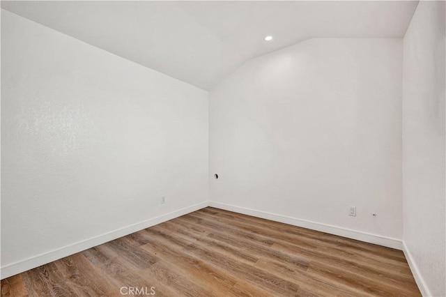 921 Dahlia Ave, Costa Mesa, CA 92626 - spare room featuring wood finished floors, vaulted ceiling, baseboards, and recessed lighting