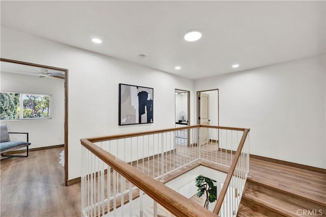 921 Dahlia Ave, Costa Mesa, CA 92626 - hallway with wood finished floors, baseboards, an upstairs landing, and recessed lighting