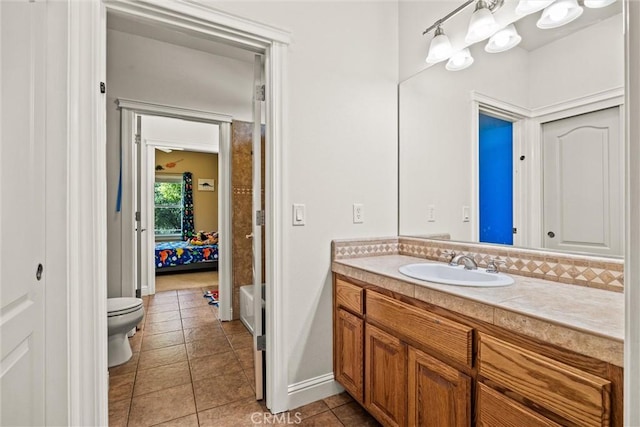 14690 Paynes Creek Rd, Red Bluff, CA 96080 - bathroom with toilet, vanity, baseboards, and tile patterned flooring