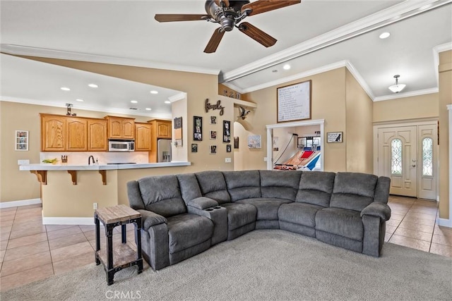 14690 Paynes Creek Rd, Red Bluff, CA 96080 - living room featuring crown molding, light tile patterned flooring, recessed lighting, baseboards, and ceiling fan