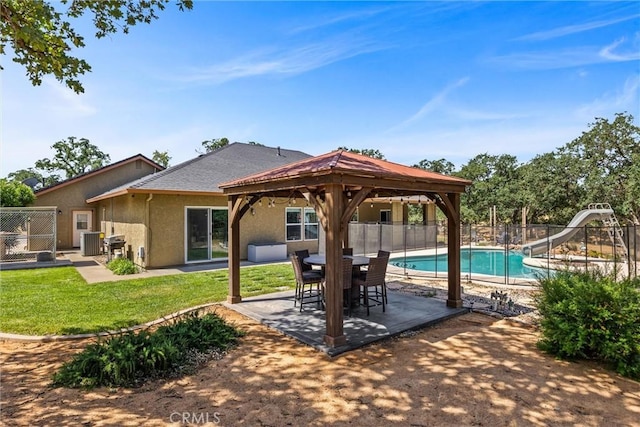 14690 Paynes Creek Rd, Red Bluff, CA 96080 - view of pool with a water slide, a gazebo, central air condition unit, and a patio area
