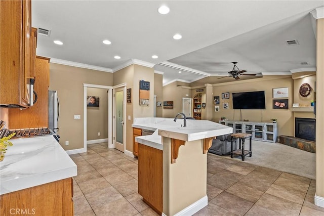 14690 Paynes Creek Rd, Red Bluff, CA 96080 - kitchen with stove, ornamental molding, brown cabinets, a ceiling fan, and recessed lighting