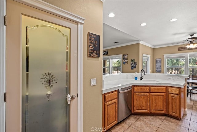 14690 Paynes Creek Rd, Red Bluff, CA 96080 - kitchen featuring dishwasher, ornamental molding, light tile patterned flooring, light countertops, and a peninsula