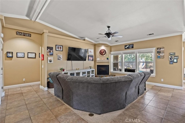 14690 Paynes Creek Rd, Red Bluff, CA 96080 - living room with a ceiling fan, light tile patterned flooring, a fireplace, ornamental molding, and baseboards
