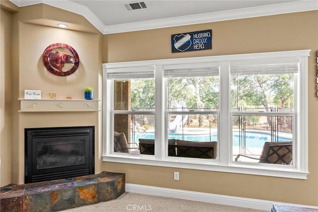 14690 Paynes Creek Rd, Red Bluff, CA 96080 - detailed view of baseboards, a fireplace, crown molding, and carpet floors
