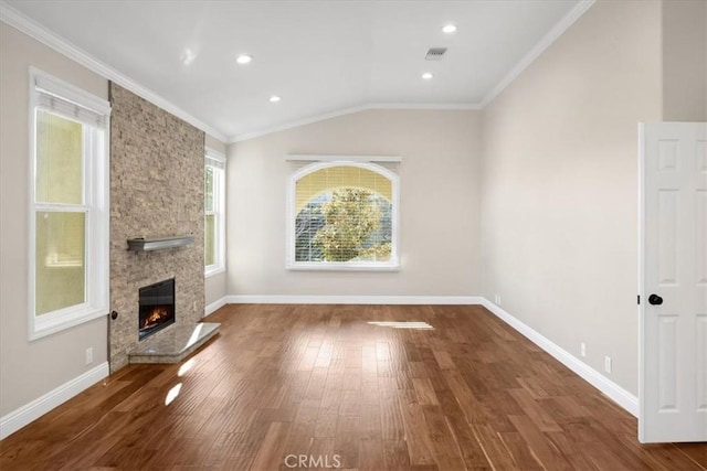5420 Kodiak Mountain Dr, Yorba Linda, CA 92887 - unfurnished living room with wood finished floors, a stone fireplace, crown molding, vaulted ceiling, and recessed lighting