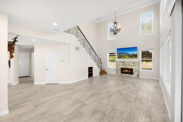 5420 Kodiak Mountain Dr, Yorba Linda, CA 92887 - unfurnished living room featuring a chandelier, stairs, a warm lit fireplace, recessed lighting, and light marble finish floors