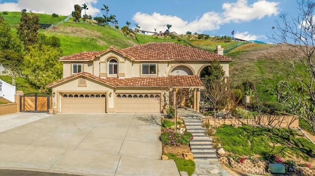 5420 Kodiak Mountain Dr, Yorba Linda, CA 92887 - mediterranean / spanish home with concrete driveway, stucco siding, stairs, and a tile roof