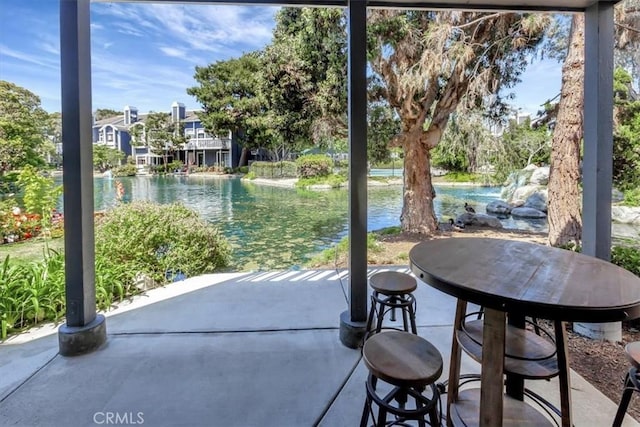 20122 Bayfront Ln Unit 102, Huntington Beach, CA 92646 - view of patio / terrace featuring a water view