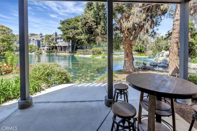 20122 Bayfront Ln Unit 102, Huntington Beach, CA 92646 - view of patio / terrace with a water view