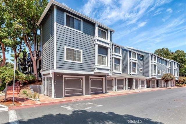 20122 Bayfront Ln Unit 102, Huntington Beach, CA 92646 - view of front of home featuring an attached garage