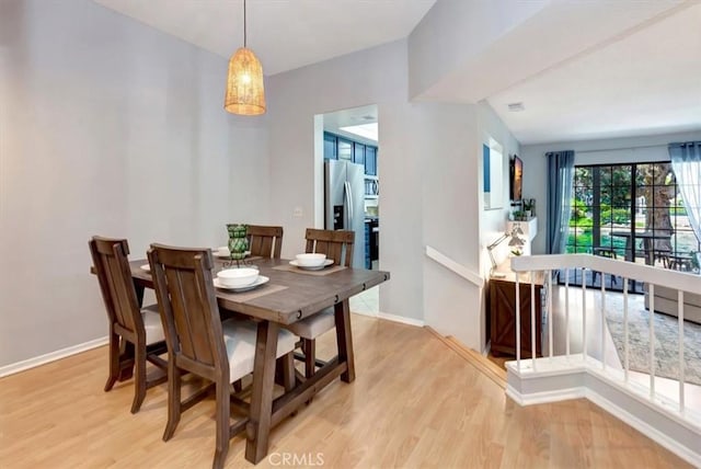 20122 Bayfront Ln Unit 102, Huntington Beach, CA 92646 - dining space with light wood-type flooring and baseboards