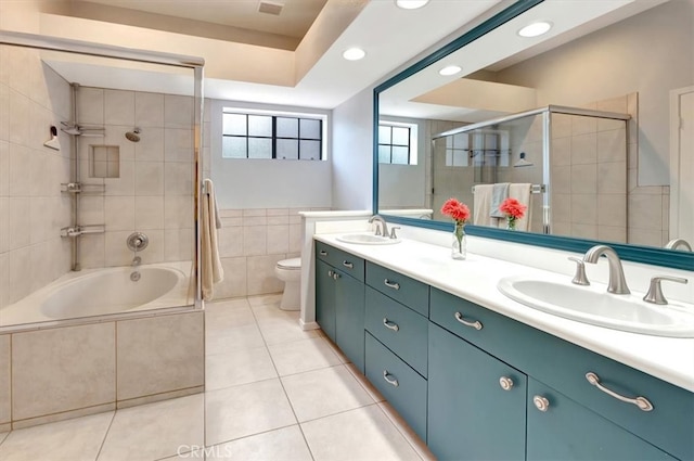 20122 Bayfront Ln Unit 102, Huntington Beach, CA 92646 - full bathroom featuring tile patterned flooring, double vanity, tile walls, toilet, and recessed lighting